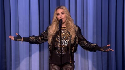 Madonna performing standup.